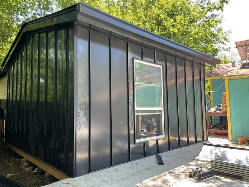 Black standing seam metal wall panels for Roof Inspection in Battlefield