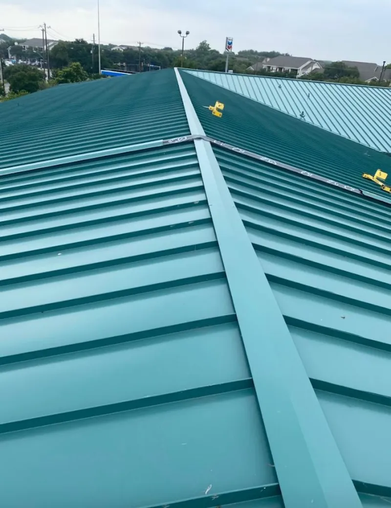 Green commercial metal roof ridge and valley for Metal Roof Repair in Battlefield