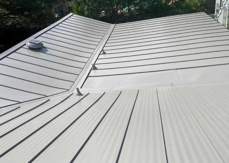Solar attic fan installed on a metal roof for Roof Ventilation in Battlefield